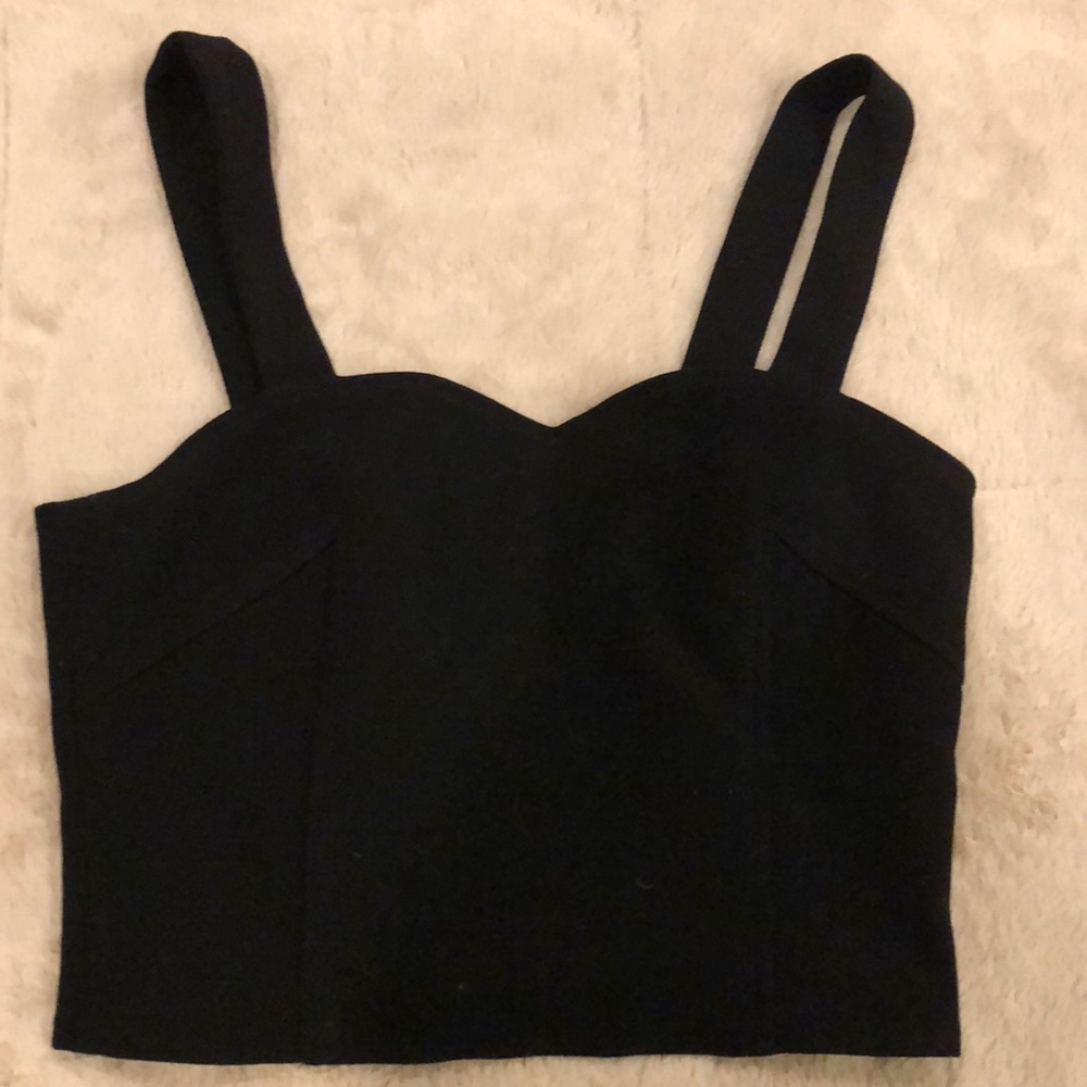 Black tank crop top with cut outs on back